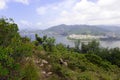 Green Tropical mountains and hiking route on the Dragon's Back trail near Hong Kong Royalty Free Stock Photo