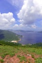 Green Tropical mountains and hiking route on the Dragon's Back trail near Hong Kong Royalty Free Stock Photo