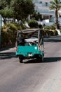 Green tuktuk on the streets in Albufeira, Portugal