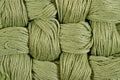 Green twisted skeins of floss as background texture