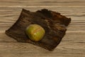 Green potato on a wooden background. Horizontal orientation. Copy space