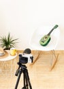 Green ukulele being recorded by a professional camera in the studio Royalty Free Stock Photo