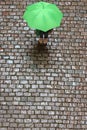 Green umbrella woman plongÃÂ©e parallelepiped Royalty Free Stock Photo