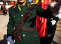 Green uniform of military with long rifle weapon marching