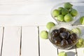 Green fig jam bowl on white wooden table Royalty Free Stock Photo