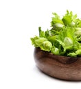 Green unripe hazelnuts in wooden bowl isolated on white Royalty Free Stock Photo