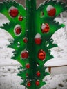 Green upside down plastic Christmas tree with red glass sphere decorations