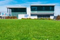 Green urban grass lawn and park under blue sky. Pier 27