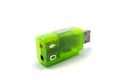 Green USB 2.0 sound card and two inputs for microphone and headset Royalty Free Stock Photo