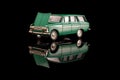 Green USSR car die-cast model on the black reflective background Royalty Free Stock Photo