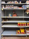 Empty peanut butter shelves at grocery store. Supply chain disruption. Royalty Free Stock Photo
