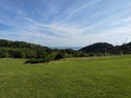 Green valley, sea and sky with clouds Royalty Free Stock Photo