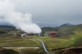 Green valley with industrial view of geothermal power station, K