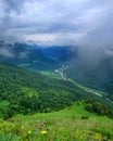 Green valley with a meandering road and river. Royalty Free Stock Photo