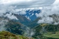 Green valley surrounded by mountains in clouds, Choquequirao trek between Yanama and Totora, Peru Royalty Free Stock Photo