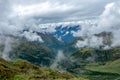 Green valley surrounded by mountains in clouds, Choquequirao trek between Yanama and Totora, Peru Royalty Free Stock Photo