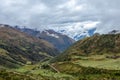 Green valley surrounded by mountains in clouds, Choquequirao trek between Yanama and Totora, Peru