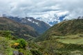 Green valley surrounded by mountains in clouds, Choquequirao trek between Yanama and Totora, Peru Royalty Free Stock Photo