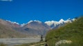 Green valley and snow mountain on the top Royalty Free Stock Photo