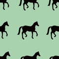 Green vector seamless pattern with black horses silhouettes Royalty Free Stock Photo