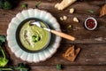 Green vegetable cream soup, with broccoli and parmesan, Clean eating, dieting, vegan, vegetarian, healthy food concept, top view Royalty Free Stock Photo