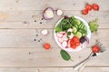 Green vegetable salad with cherry tomatoes, cucumber, radish and fresh arugula, detox diet. Healthy natural breakfast for weight Royalty Free Stock Photo