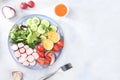 Green vegetable salad with cherry tomatoes, cucumber, radish and fresh arugula, detox diet. Healthy natural breakfast for weight Royalty Free Stock Photo