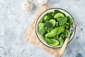 Green vegetable salad with spinach, avocado, green peas and olive oil in bowl on light gray slate, stone or concrete background. Royalty Free Stock Photo