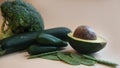 Green vegetables for cooking. Avocado, broccoli, pepper, peas, zucchini on light background Royalty Free Stock Photo