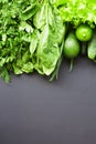 Green vegetables and fruits on dark background Royalty Free Stock Photo