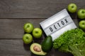 Green vegetables and fruits for detox on wooden background, healthy vegetarian food Royalty Free Stock Photo