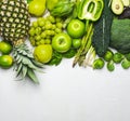 Green vegetables and fruits on a white background. Fresh organic produce Royalty Free Stock Photo