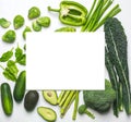 Green vegetables and herbs assortment on a white background. Royalty Free Stock Photo