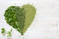 Green vegetables and herbs in heart health concept Royalty Free Stock Photo