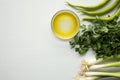 Green vegetables on white background: paprika, parsley, olive oil, onion Royalty Free Stock Photo