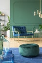 Green pouf in modern living room interior Royalty Free Stock Photo