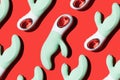green vibrators pattern for masturbation on a red background