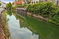 Green view of the canal of old part in Bruges. Royalty Free Stock Photo