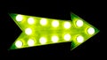 Green vintage bright and colorful illuminated metallic display arrow sign with glowing light bulbs isolated wide dark background