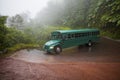 A green vintage bus in the La Paz Waterfall Gardens, Costa Rica