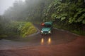 A green vintage bus in the La Paz Waterfall Gardens, Costa Rica