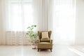 Green vintage chair in the interior of the white room Royalty Free Stock Photo