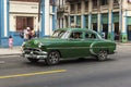 Green vintage Chevrolet taxi Havana