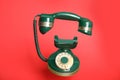 Green vintage corded phone on background Royalty Free Stock Photo