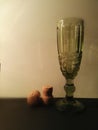 Green vintage glass and two champagne corks  on white background. Royalty Free Stock Photo