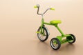 Green vintage kid\'s tricycle. Copy space on the left side. 3D illustration Royalty Free Stock Photo