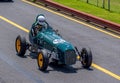 Green vintage racing car at Sandown racecourse