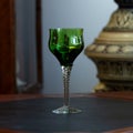 Green vintage wine glass close-up. antique wine glass Royalty Free Stock Photo