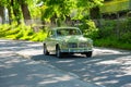 Green 1966 Volvo Amazon classic car on a small road..