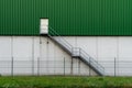 Green wall of modern building - stairway and door - concept image Royalty Free Stock Photo